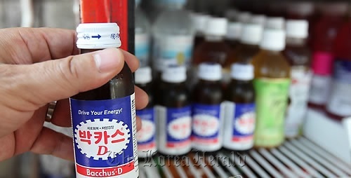 A customer buys a Bacchus drink at a convenient store.   Yonhap News