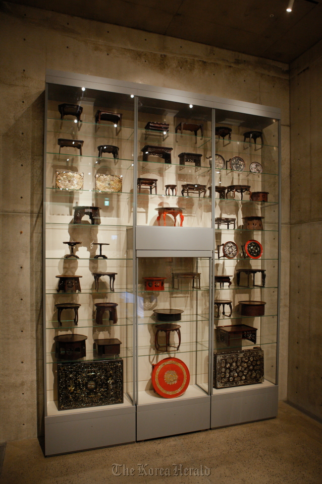 A display case is filled with soban, or dining tables, at Bonte Museum.   Bonte Museum