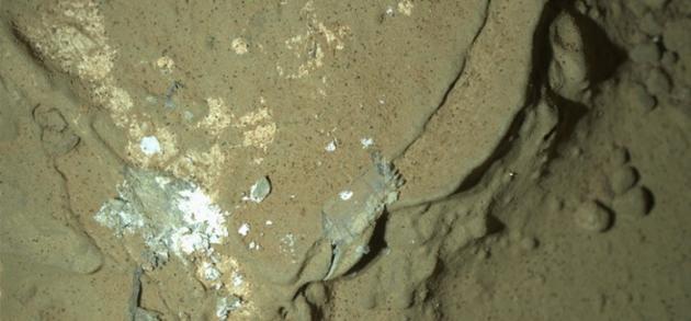 This image of a Martian rock illuminated by white-light LEDs is part of the first set of nighttime images taken by NASA's Mars rover Curiosity. (NASA-UPI)