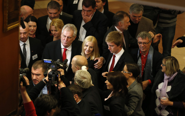 Presidential candidate Milos Zeman (center) smiles while addressing the media after announcing the preliminary results of the presidential elections in Prague on Saturday.   AP-Yonhap News