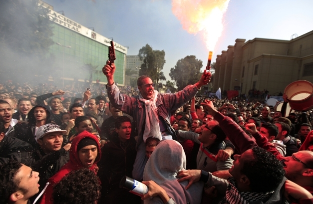 Supporters of Cairo's Al-Ahly celebrates after the verdict. (AP)