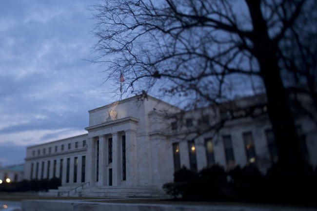 The Marriner S. Eccles Federal Reserve building stands in Washington, D.C., in this photo taken with a tilt shift lens in U.S., on Tuesday, Jan. 29, 2013. Federal Reserve Chairman Ben S. Bernanke? latest round of bond buying will reach $1.14 trillion before he ends the program in the first quarter of 2014, according to median estimates in a Bloomberg survey of economists. Photographer: Andrew Harrer/Bloomberg
The Marriner S. Eccles Federal Reserve building stands in Washington, D.C.   Bloomberg