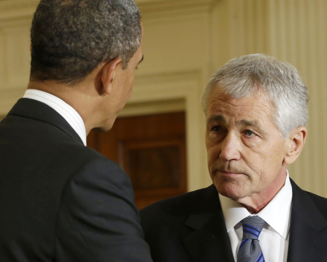 U.S. President Barack Obama shakes hands with Defense Secretary-nominee Chuck Hagel at the White House in Washington on Jan. 7.   AP-Yonhap News