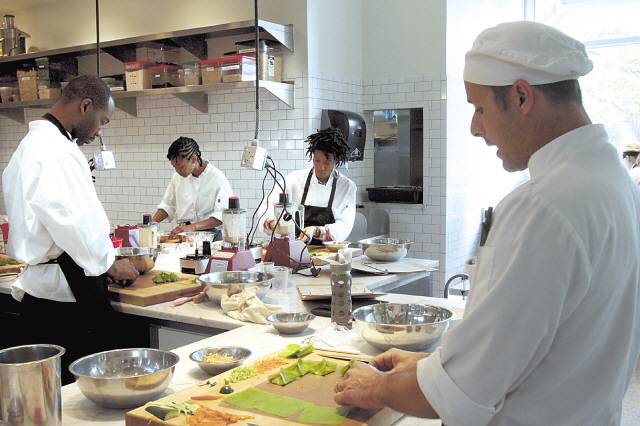 Chef Michael Vincent (right) teaches during a weekend class at the Matthew Kenney Academy, a new raw food culinary academy in Santa Monica, California, on Dec. 9, 2012. (Los Angeles Times/MCT)