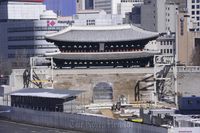 Sungnyemun, National Treasure No. 1, is shown undergoing the final restoration process on Monday.   Park Hae-mook/The Korea Herald