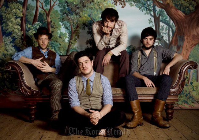 The four members of the popular American folk band Mumford & Sons.    umford & Sons