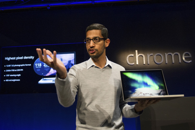 Sundar Pichai, senior vice president of Chrome at Google, holds up the new Chromebook Pixel on Thursday.   Bloomberg