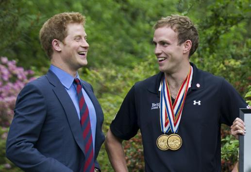 Prince Harry talks with Capt. Simon Maxwell, British Royal Marines, Wound Warriors Games medalist during a reception for U.S. and British wounded warriors at the British Ambassador's Residence in Washington, D.C. on May 7, 2012. (UPI)