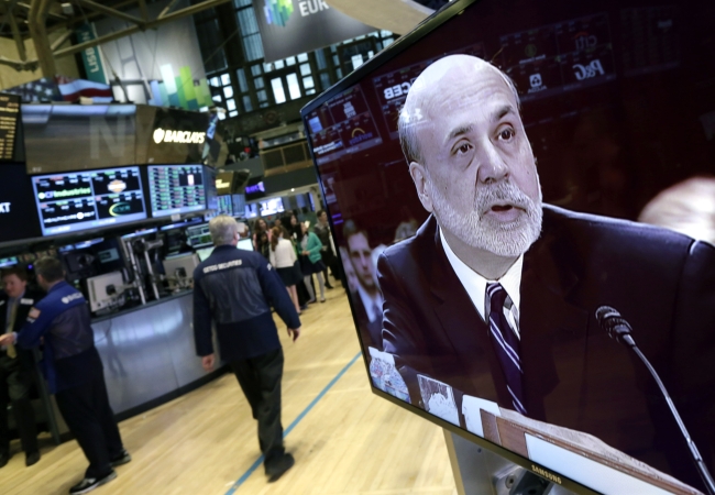 Federal Reserve Chairman Ben Bernanke is seen on a monitor on the floor of the New York Stock Exchange on Tuesday.   AP-Yonhap News