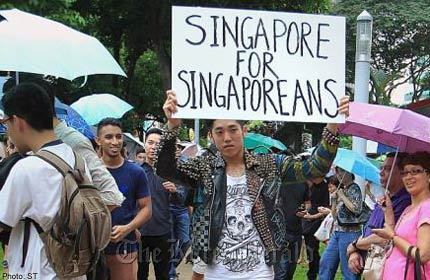 A young man, who goes by the online name Daryl Nihility, attended the protest in Hong Lim Park last Saturday in punk attire and held up a sign saying “Singapore for Singaporeans.” He has denied being xenophobic.   The Straits Times