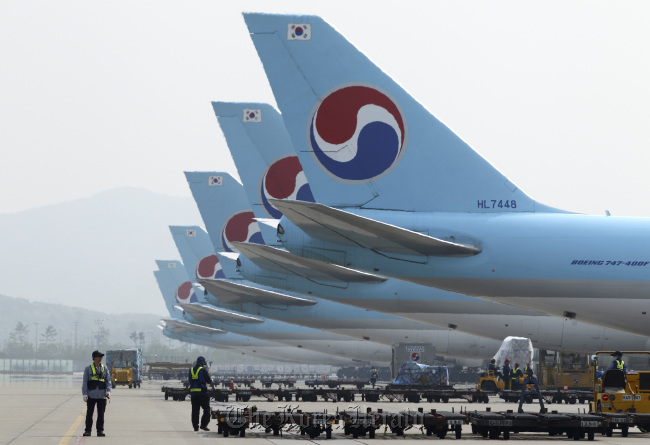 Korean Air planes are parked on the tarmac at the company’s cargo terminal at Incheon International Airport.     Bloomberg