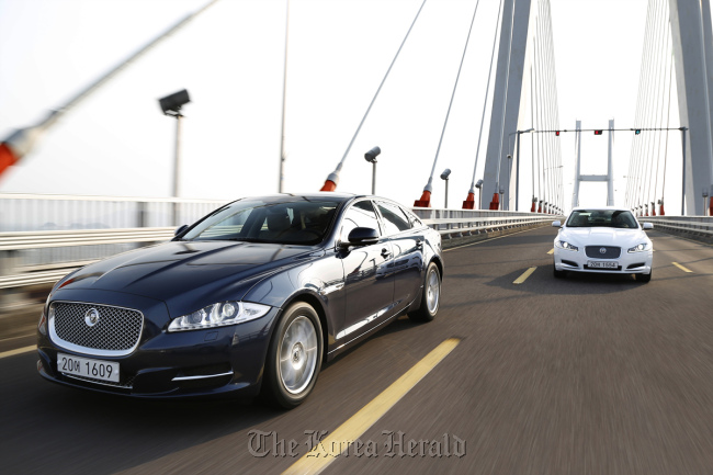 The 2.0-liter petrol Jaguar XJ (left) and the XF sports sedan.   Jaguar Land Rover Korea