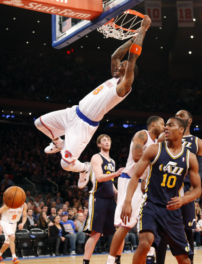 Utah Jazz Derrick Favors watches New York Knicks J.R. Smith dunk the basketball in the first half at Madison Square Garden in New York City on Saturday.   UPI-Yonhap News