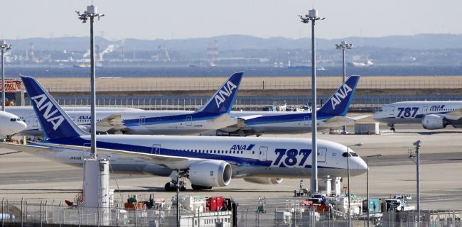 All Nippon Airways’ Boeing 787 Dreamliner passenger jets are parked on the tarmac at Haneda airport in Tokyo.     AP-Yonhap News