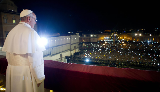 Pope Francis looks at the crowd from the central balcony of St. Peter’s Basilica at the Vatican on Wednesday.   AP-Yonhap News