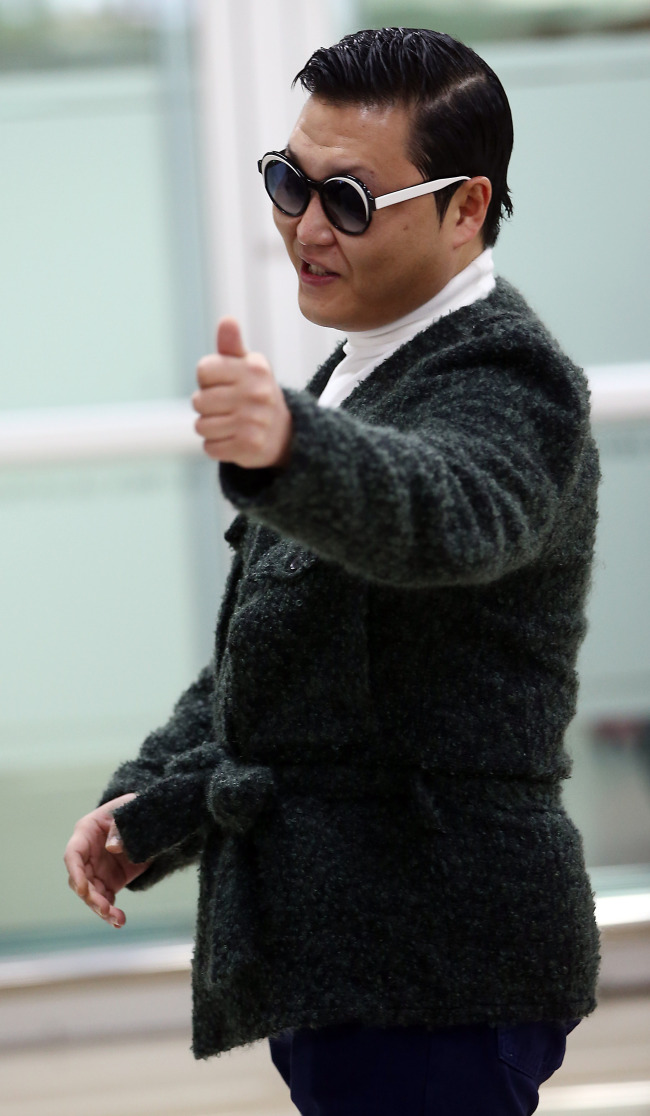 Psy arrives at Gimpo International Airport on Sunday where he revealed the title of his possible upcoming single “Assarabia,” which is one of the two songs that he has prepared as his “Gangnam Style” follow-up.   Yonhap News