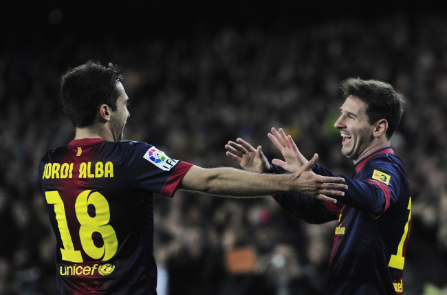 FC Barcelona’s Lionel Messi (right) celebrates with teammate Jordi Alba after his goal on Sunday.   AP-Yonhap News