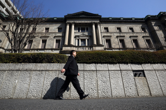 A man walks past the Bank of Japan headquarters in Tokyo.  Bloomberg