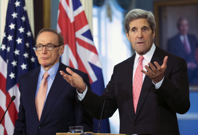 U.S. Secretary of State John Kerry (right), accompanied by Australian Foreign Minister Bob Carr, speaks to reporters following their meeting at the State Department in Washington on Monday.   AP-Yonhap News