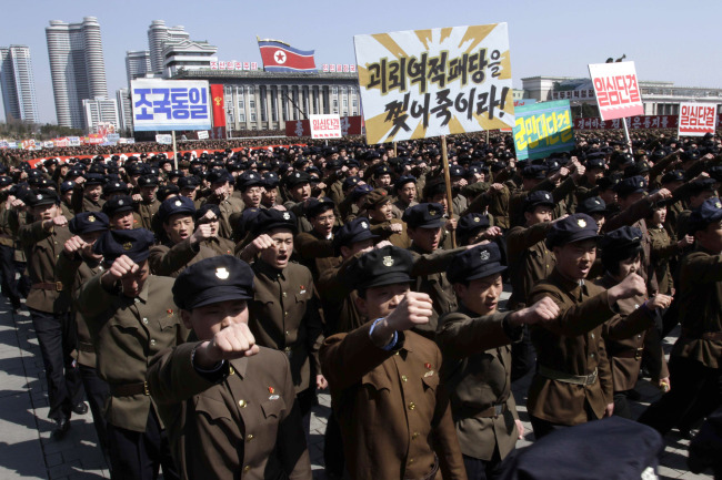 North Korean students participate in a rally to show support for their leader Kim Jong-un in Pyongyang on Thursday. (AP-Yonhap News)