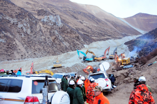 Rescuers work at the site where a landslide hit a mining area in Maizhokunggar County of Lhasa, the capital of southwest China’s Tibet Autonomous Region, Saturday.   AP-Yonhap News
