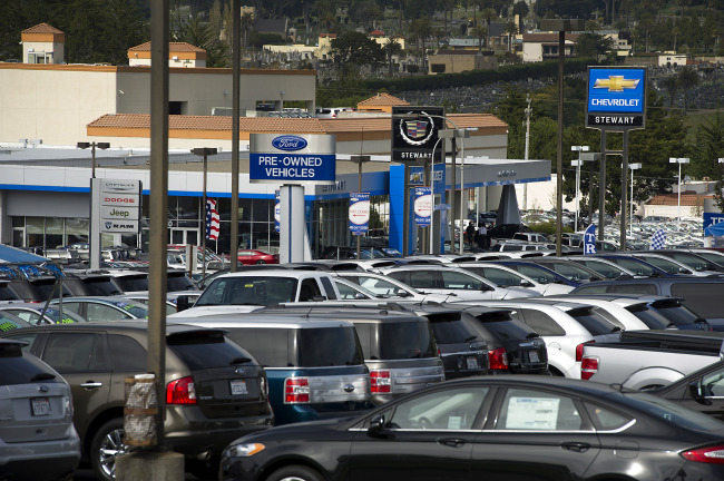 Signage for car dealerships is seen in Colma, California, Friday.  Bloomberg