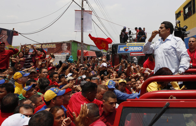 Venezuela’s interim President Nicolas Maduro blows a kiss to supporters from the top of a vehicle as he campaigns in a caravan from Sabaneta to Barinas, in Sabaneta, Venezuela, Tuesday.   AP-Yonhap News