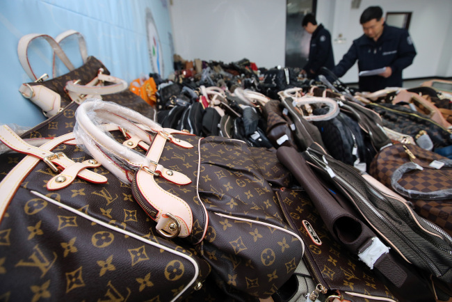 Seized counterfeit goods are shown at a Seoul City office Wednesday. Yonhap News