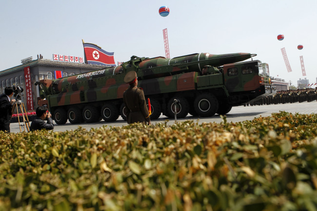 A North Korean vehicle carrying what appears to be a new missile passes by during a mass military parade in Pyongyang’s Kim Il-sung Square to celebrate the centenary of the birth of the late North Korean founder Kim Il-sung on April 15, 2012.   AP-Yonhap News