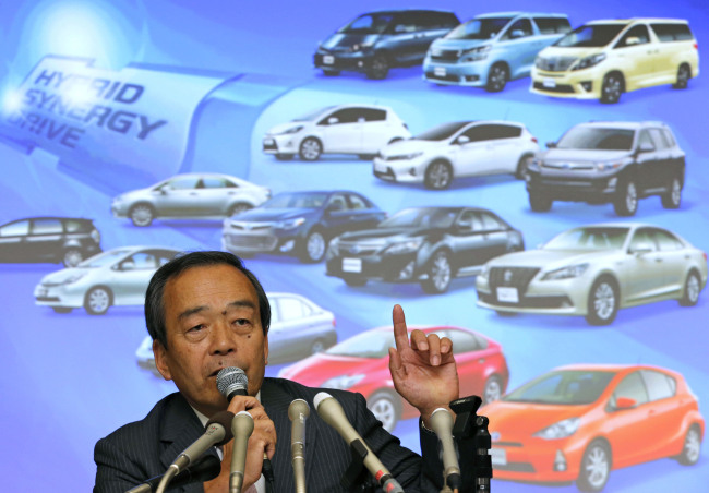 Takeshi Uchiyamada, vice chairman of Toyota Motor Corp., speaks during a press conference at its headquarters in Tokyo on Wednesday.   AP-Yonhap News