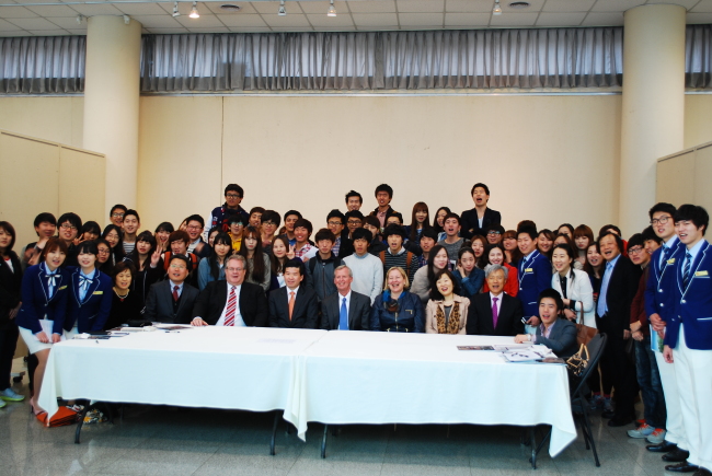 Organizers including AMCHAM Korea chairman Pat Gaines (center seated) and students pose after attending the “Innovation Camp” at Chungbuk National University in Cheongju on Friday.   Chungbuk National University