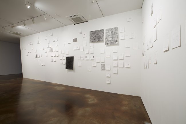 Drawings of artist Lee Mi-yeon are posted on the inclined wall of the K2 exhibition hall at Kukje Gallery. The inclined wall serves as a metaphorical image of the exhibition title “The Song of Slant Rhymes,” which aims to explore “imperfect relationships” that young artists have with society.    Kukje Gallery