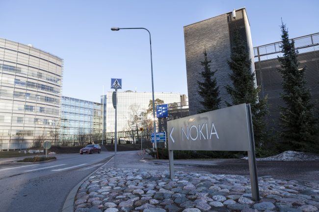 A sign stands at the entrance to the Nokia headquarters in Espoo, Finland.   Bloomberg