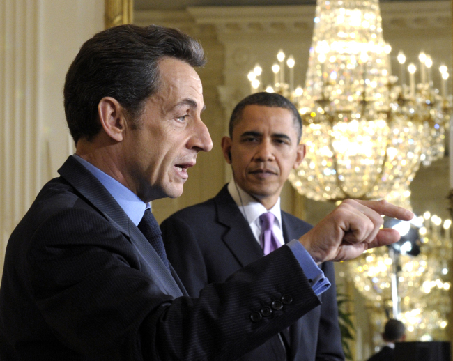 U.S. President Barack Obama listens as then-French President Nicolas Sarkozy speaks in the East Room of the White House in Washington on March 30, 2010.   AP-Yonhap News