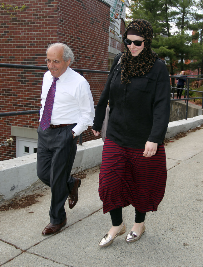 Katherine Russell (right), wife of Boston Marathon bombing suspect Tamerlan Tsarnaev, leaves the law office of DeLuca and Weizenbaum with attorney Amato DeLuca (left) in Providence, Rhode Island, Monday.   AP-Yonhap News