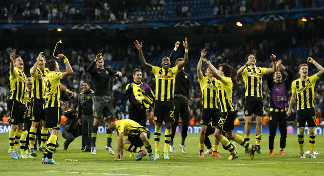 Dortmund players celebrate after their match against Real Madrid on Tuesday.   AP-Yonhap News