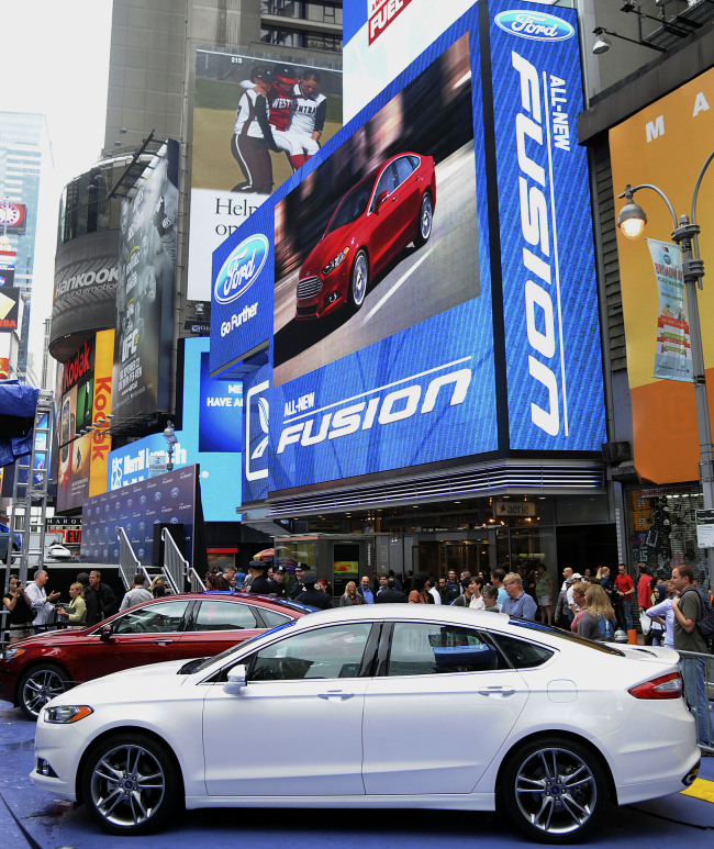 The new 2013 Ford Motor Fusion vehicle stands after being unveiled during an event in New York.   Bloomberg
