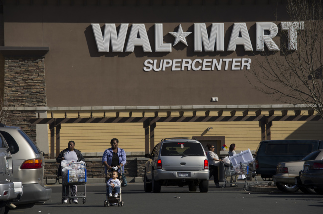 Customers exit a Wal-Mart in American Canyon, California.  Bloomberg
