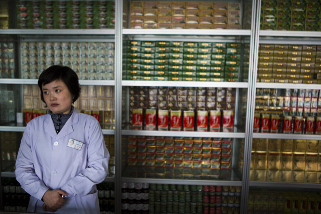 In this Feb. 21, a pharmacist waits for customers at the Man Nyon Pharmacy, the nation’s largest dispensary of traditional “Koryo” medicine, in Pyongyang. North Korea began marrying traditional medicine with modern practice in the 1950s after the Korean War.   AP-Yonhap News