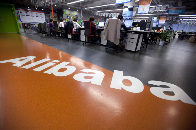 Employees work at Alibaba.com Ltd.’s headquarters in Hangzhou, Zhejiang Province, China.   Bloomberg