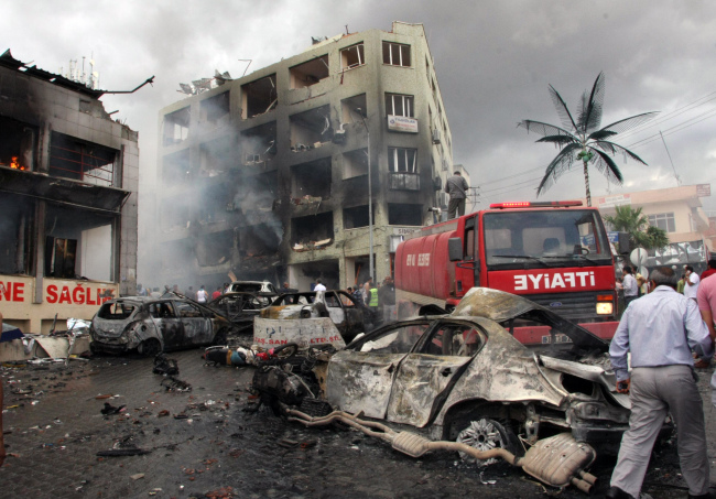 The site of one of the explosions after several killed at least 43 people and injured dozens in Reyhanli, near Turkey’s border with Syria, Saturday.   AP-Yonhap News