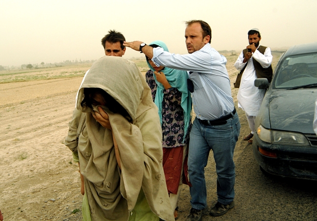 Two female hostages are escorted after being freed by Taliban who kidnapped 23 Korean Christian missionaries in Afghanistan in July 2007.  The ordeal gripped the nation and led the government to implement a travel ban immediately after the release of the surviving 19 hostages in August 2007.   Herald file photo