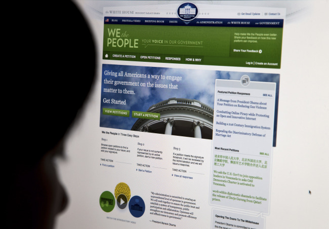 The White House’s online petition site called “We the People” is displayed on a computer screen in Beijing on Sunday.   AP-Yonhap News
