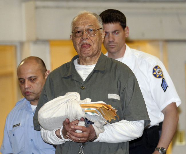 Dr. Kermit Gosnell is escorted to a waiting police van upon leaving the Criminal Justice Center in Philadelphia on Monday.   AP-Yonhap News