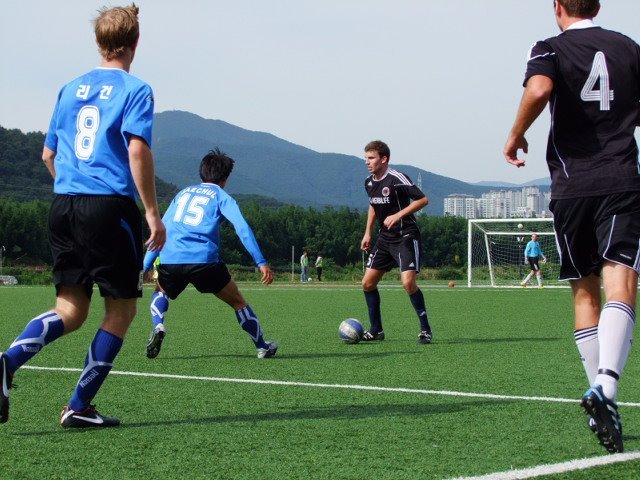 Busan United (black) play Won Shot Wanderers in a previous Ulsan Cup Tournament.
