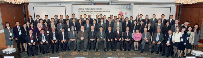 Officials of the International Association of Deposit Insurers pose for a photo ahead of a conference in Seoul, Tuesday.   KDIC