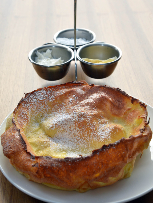 The Original Pancake House’s Dutch Baby, a souffle-like pancake dusted in powdered sugar, is served with whipped butter and lemon.   Kim Myung-sub/The Korea Herald