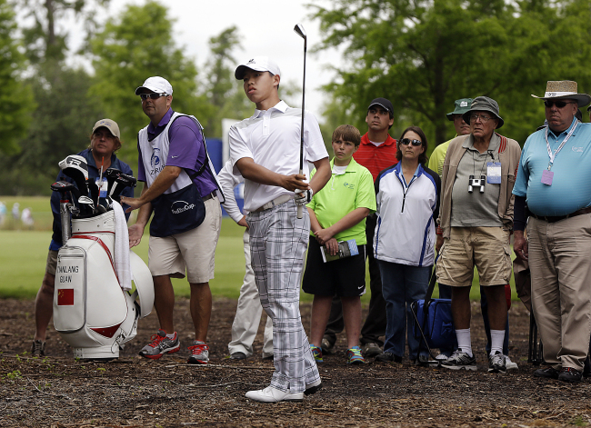 China’s Guan Tianlang plays a shot during the Zurich Classic golf tournament last month.   AP-Yonhap News