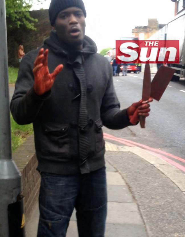 This video grab image provided by the Sun newspaper shows one of the men involved in the murder of a man believed to be a serving British soldier as he speaks following the attack in London on Wednesday.   AFP-Yonhap News