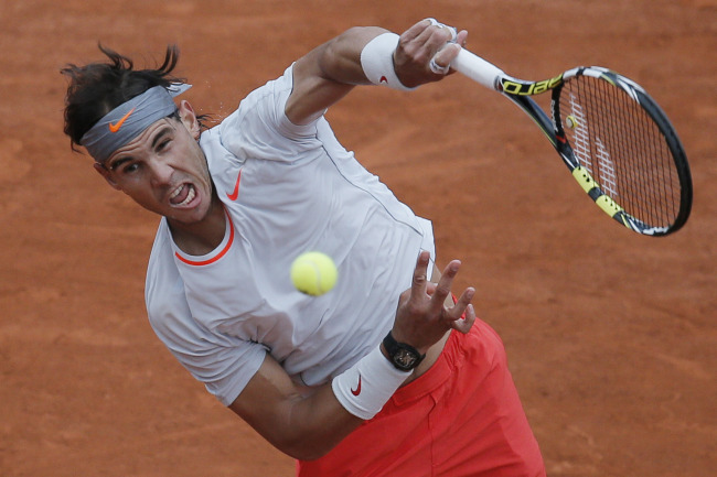 Rafael Nadal serves against Fabio Fognini at the French Open in Paris on Saturday.   AP-Yonhap News